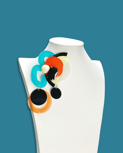 Geometric-shaped fashion brooch in cerulean color with acrylic, sequins, and beads.