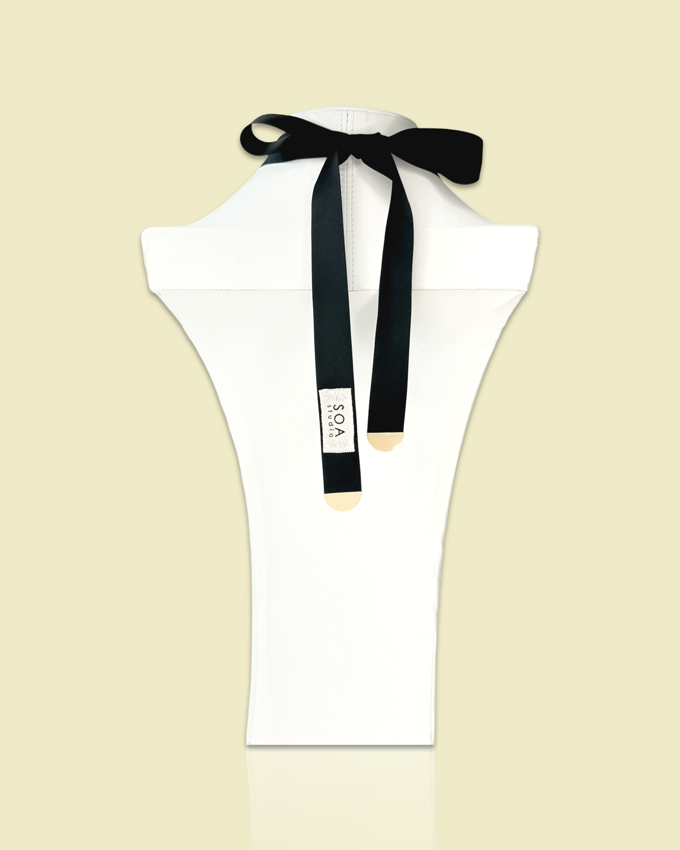 Arty shaped elegant necklace brooch in creamy color with irregular die-cut acrylic, sequins, and gem details, featuring silk ribbon fastening.