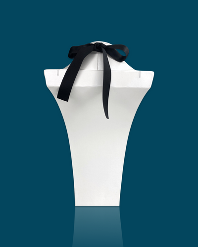 Fashion bold necklace with irregular acrylic design, circle hardware, and silk ribbon fastening.