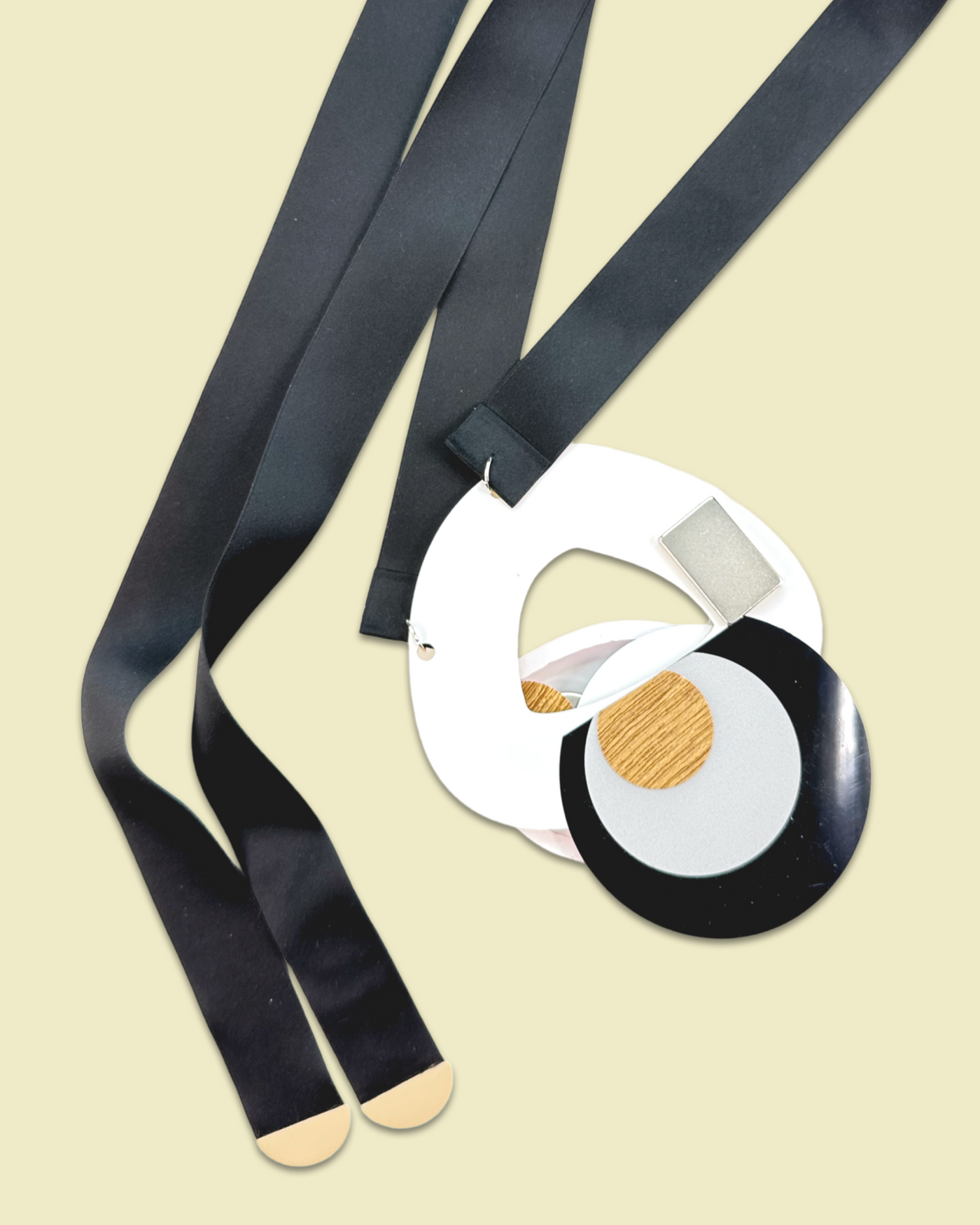 Arty shaped elegant necklace brooch in creamy color, featuring irregular die-cut acrylic, sequins, plastic gem, and silk ribbon fastening.