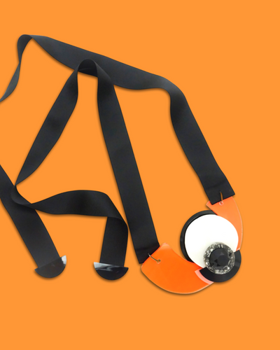 Funky abstract shape necklace brooch in tiger color with black silk ribbon and acrylic hardware.