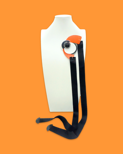 Funky abstract shape necklace brooch with tiger color accents, acrylic hardware, and marble pattern.