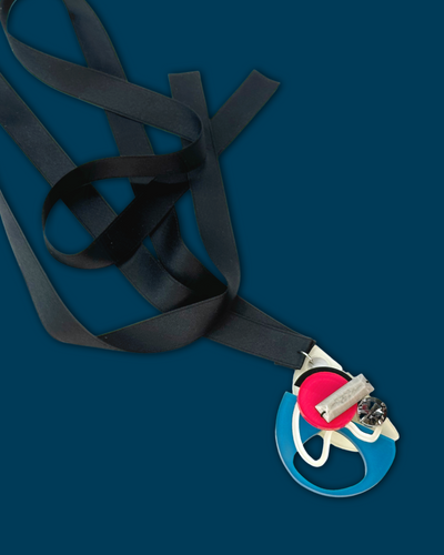 Blob shape necklace in ocean magenta color with irregular acrylic hardware and silk ribbon.