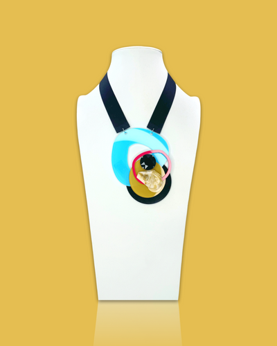 Bold fashion necklace brooch in Arctic Colour, irregular acrylic shape with sequins and plastic gem, hand-made with silk ribbon fastening.