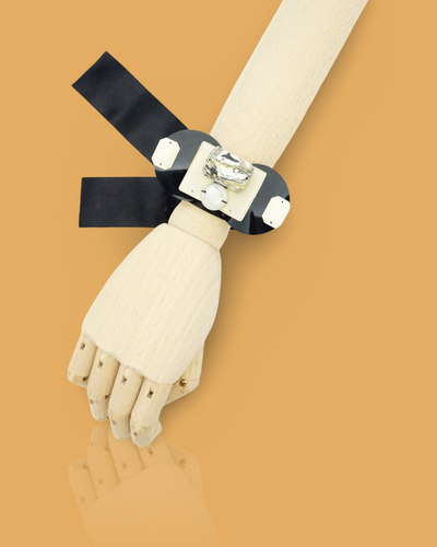 Handmade beige bracelet with ribbon tie-up and plastic beads featuring a marble pattern print.