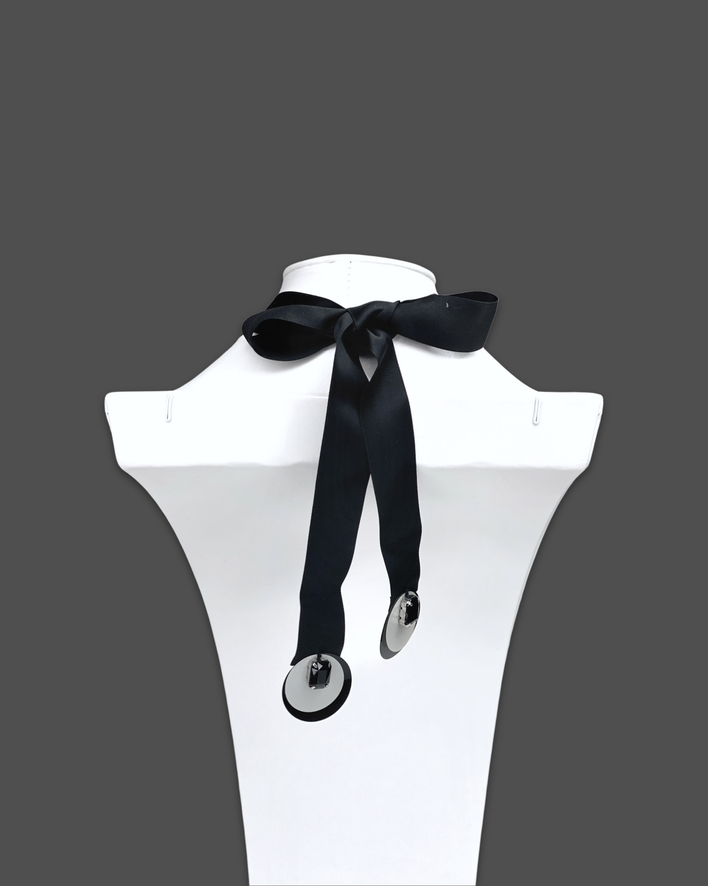 Geometric shapes necklace brooch in white color with irregular acrylic and marble pattern, featuring silk ribbon fastening.
