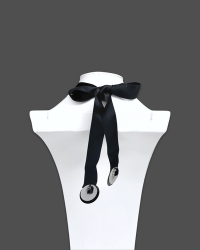 Geometric shapes necklace brooch in white color with irregular acrylic and marble pattern, featuring silk ribbon fastening.