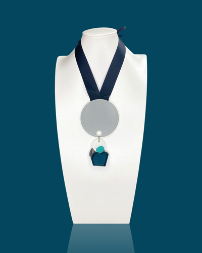 Fashion bold necklace with irregular acrylic hardware and silk ribbon fastening.