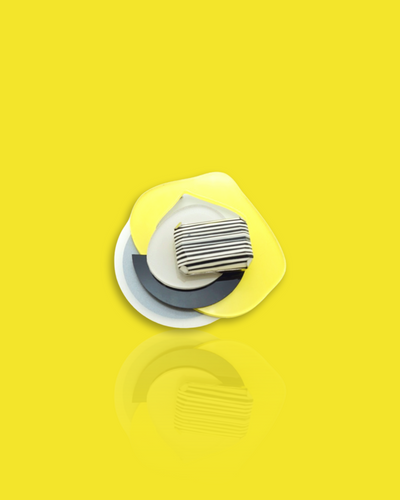 Avant-garde brooch with striped bead in lemon color, featuring palladium and acrylic yellow hardware.