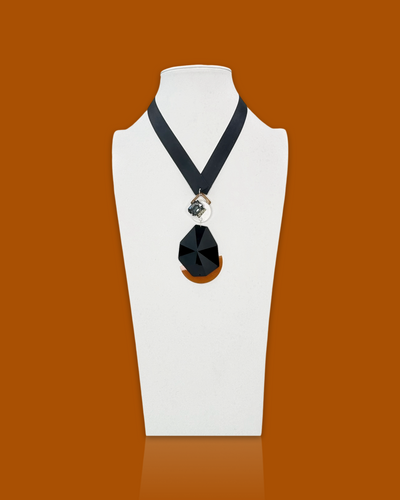 Bold elegant necklace in tawny color with acrylic gem and silk ribbon.