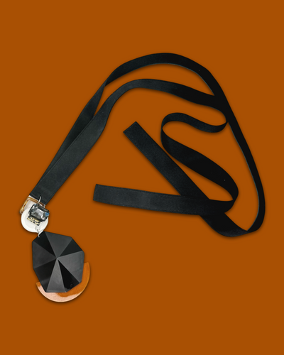 Bold elegant necklace in tawny color with irregular shape acrylic piece and silk ribbon.