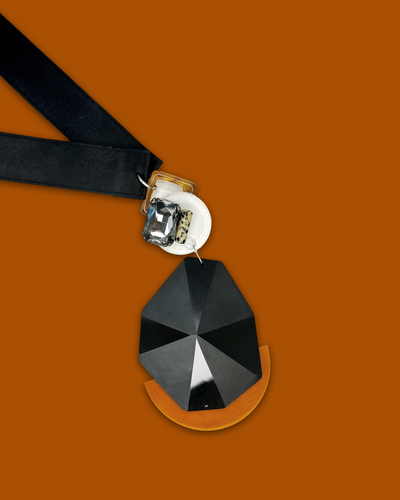 Bold elegant necklace in tawny color with acrylic pendant and silk ribbon.